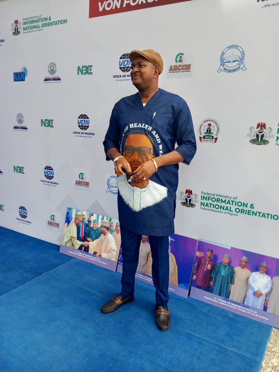 Embassy representative at the VON Forum 2026 backdrop, themed 51 Years of Nigeria's Role in Deepening Democratic Stability in ECOWAS